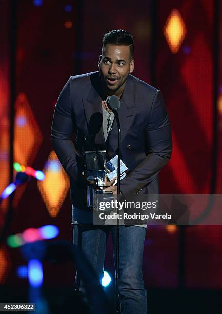 Romeo Santos accepts an award onstage during the Premios Juventud 2014 at The BankUnited Center on July 17, 2014 in Coral Gables, Florida.