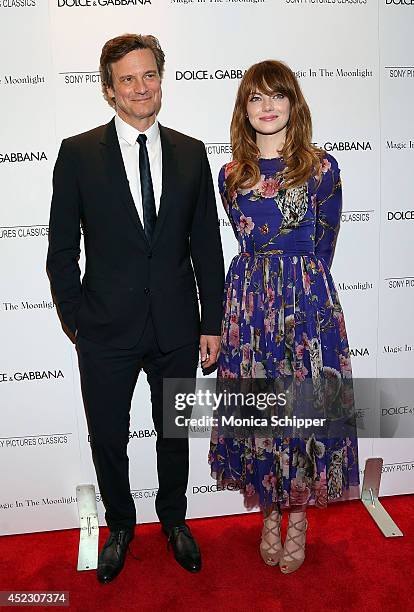 Actor Colin Firth and actress Emma Stone, both wearing Dolce & Gabbana, attend "Magic In The Moonlight" premiere at Paris Theater on July 17, 2014 in...