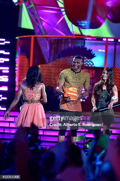 Gymnast Gabby Douglas accepts the Best Female Athlete Award with NBA player Russell Westbrook and actress Megan Fox onstage during Nickelodeon Kids'...