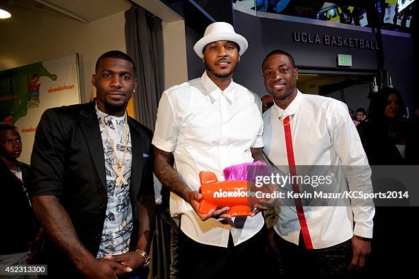 Player Dez Bryant, NBA player Carmelo Anthony and NBA player Dwyane Wade attend the Nickelodeon Kids' Choice Sports Awards 2014 at UCLA's Pauley...