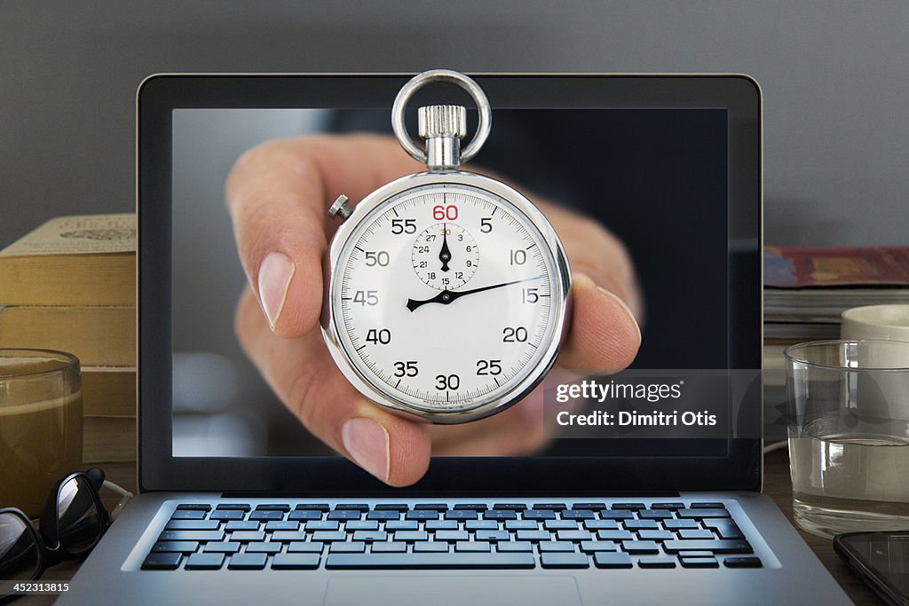 Stopwatch appearing out of Laptop computer screen