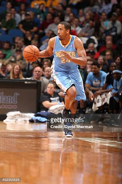 Andre Miller of the Denver Nuggets moves the ball up-court against the Minnesota Timberwolves on November 27, 2013 at Target Center in Minneapolis,...