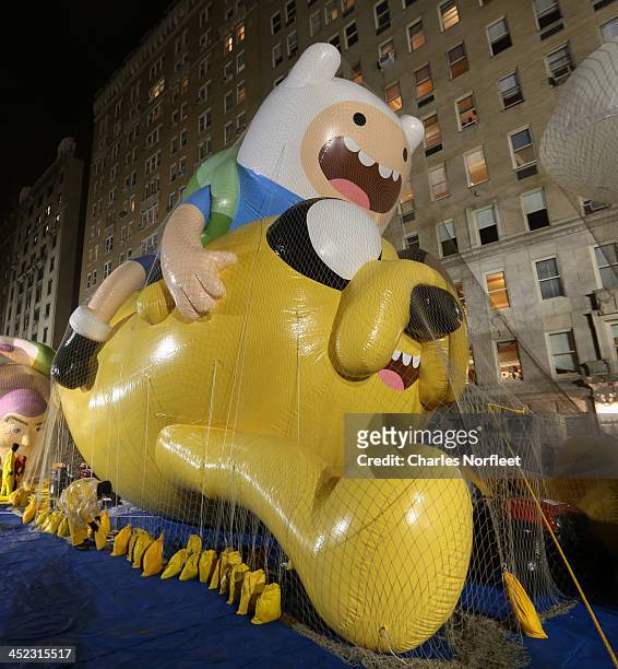 Jake and Finn of "Adventure Time" balloon at inflation eve for the 87th Annual Macy's Thanksgiving Day Parade on November 27, 2013 in New York City.
