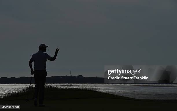 Adam Scott of Australia celebrates a birdie putt on the 13th green during the first round of The 143rd Open Championship at Royal Liverpool on July...