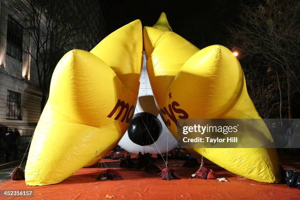 Snoopy peeks through the Macy's stars during Inflation Eve at the American Museum of Natural History on November 27, 2013 in New York City.