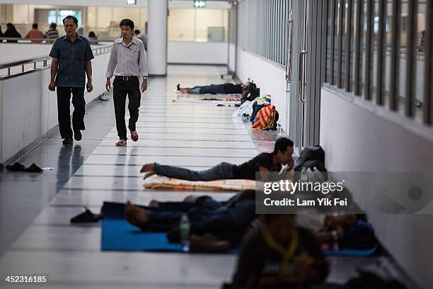 Protesters rest as anti-government protesters occupy the Government Complex on November 28, 2013 in Bangkok, Thailand. Protests began in Bangkok on...