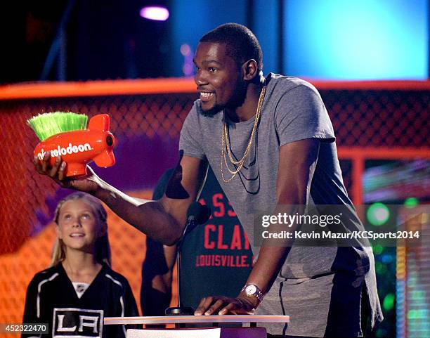 Player Kevin Durant accepts the Best Male Athlete Award onstage at the Nickelodeon Kids' Choice Sports Awards 2014 at UCLA's Pauley Pavilion on July...