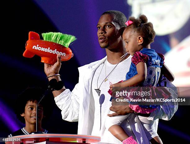 Player Victor Cruz and Kennedy Cruz speak onstage at the Nickelodeon Kids' Choice Sports Awards 2014 at UCLA's Pauley Pavilion on July 17, 2014 in...