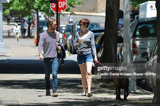 November 18: Anne Hathaway and Adam Shulman with their dog, Esmeralda are seen on June 12, 2013 in New York City.