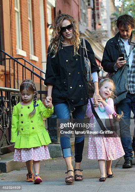 September 23: Sarah Jessica Parker walk with daughters Marion Loretta Elwell Broderick and Tabitha Hodge Broderick in the West Village on September...