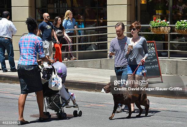 November 18: Anne Hathaway and Adam Shulman with their dog, Esmeralda are seen on June 12, 2013 in New York City.