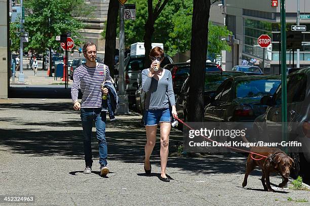 November 18: Anne Hathaway and Adam Shulman with their dog, Esmeralda are seen on June 12, 2013 in New York City.