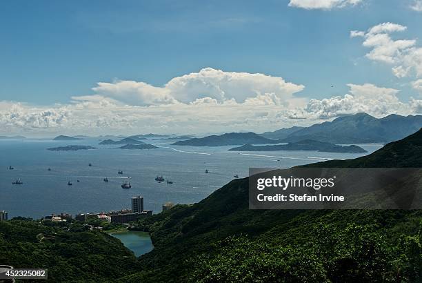 View of Pok Fu Lam country park and Pok Fu Lam reservoir with the West Lamma Channel and various out-lying islands including Lantau beyond.