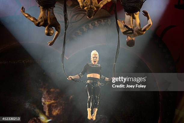 Nk hanging upside down as she performs in concert during 'The Truth About Love' tour at Bankers Life Fieldhouse on November 21, 2013 in Indianapolis,...