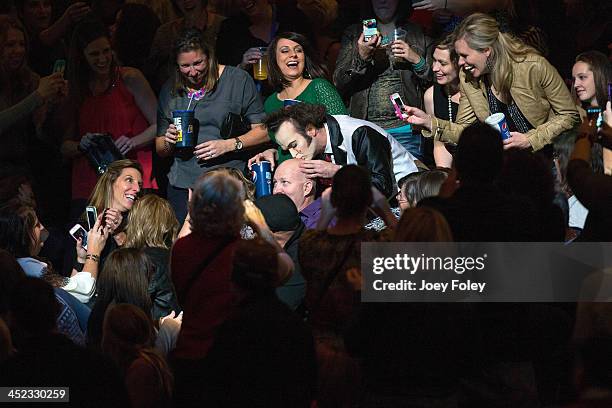 Performer Jimmy Slonina kissing a man's heads during the P!nk The Truth About Love' tour at Bankers Life Fieldhouse on November 21, 2013 in...
