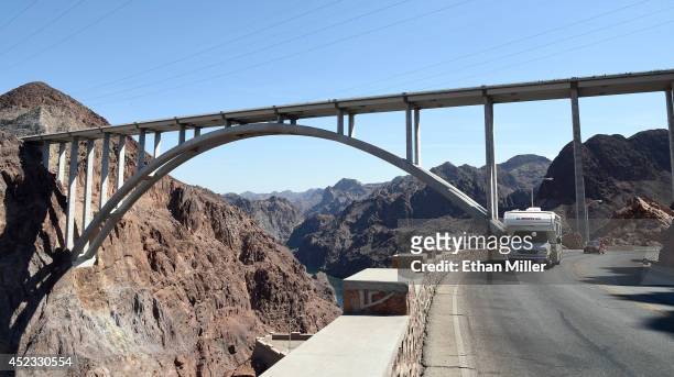 Vehicles drive under the Mike O'Callaghan-Pat Tillman Memorial Bridge part of the Hoover Dam Bypass on July 17, 2014 in the Lake Mead National...