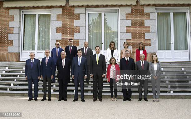 King Felipe VI of Spain poses with Ministers of Economy, Luis de Guindos; Industry, Jose Manuel Soria; Education, Jose Ignacio Wert; Employment,...