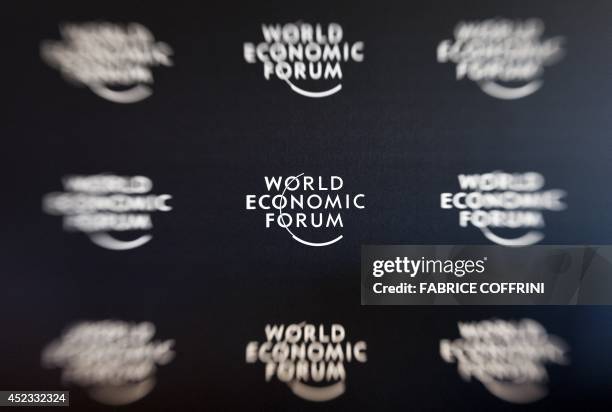 Long-exposure photo taken on January 19, 2011 shows World Economic Forum logos during a press conference of WEF founder and executive chairman Klaus...