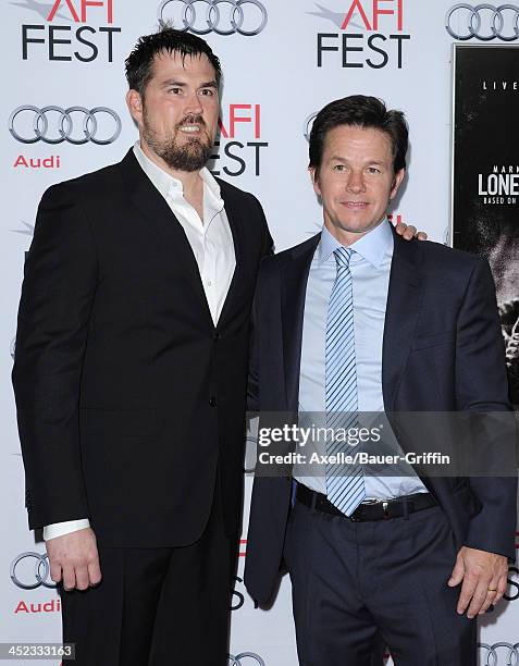 Retired petty officer 1st class Marcus Luttrell and actor Mark Wahlberg attend the screening of 'Lone Survivor' at AFI FEST 2013 at the TCL Chinese...