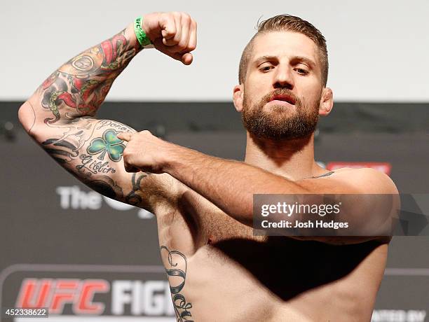 Cody Donovan poses on the scale after weighing in during the UFC weigh-in event at The O2 on July 18, 2014 in Dublin, Ireland.