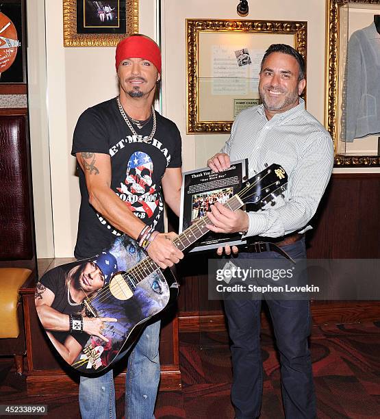 Singer/TV personality Bret Michaels and Hard Rock Cafe New York GM Daniel Sarroino attend The Bret Michaels guitar donation at Hard Rock Cafe New...