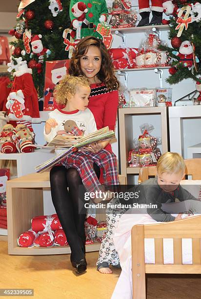 Myleene Klass attends a photocall ahead of VIP Christmas party at the newly refurbished Oxford Street Store at Mothercare Oxford Street on November...