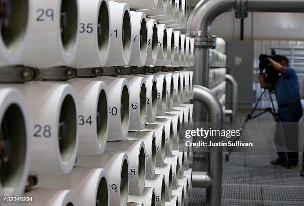 Television cameraman documents the reverse osmosis system at the new Silicon Valley Advanced Water Purification Center on July 18, 2014 in San Jose,...