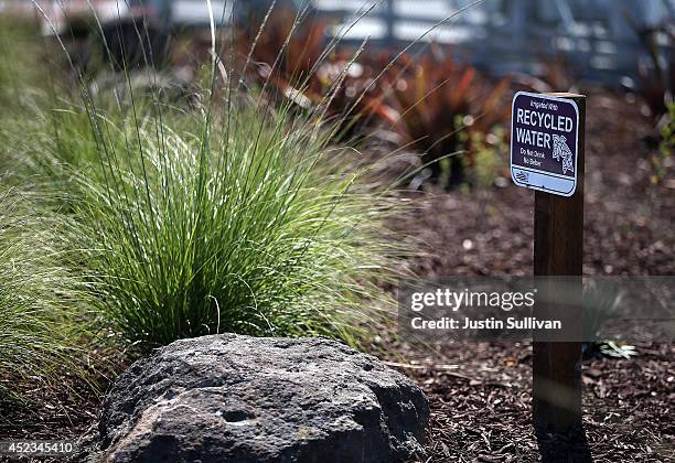 Sign announcing the use of recycled water is posted in a garden at the new Silicon Valley Advanced Water Purification Center on July 18, 2014 in San...