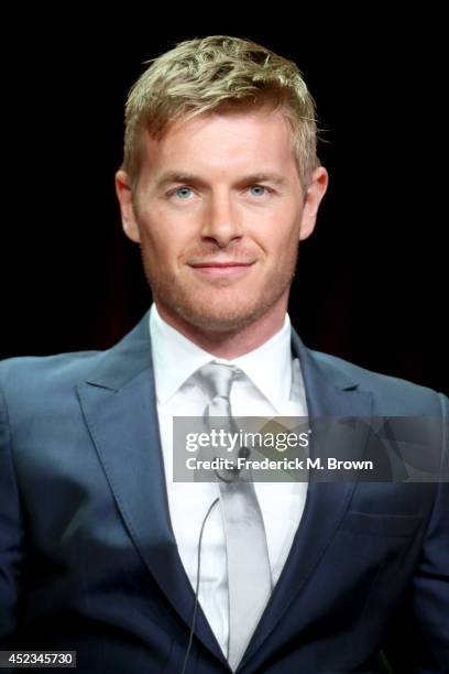 Actor Rick Cosnett speaks onstage at the "The Flash" panel during the CW Network portion of the 2014 Summer Television Critics Association at The...