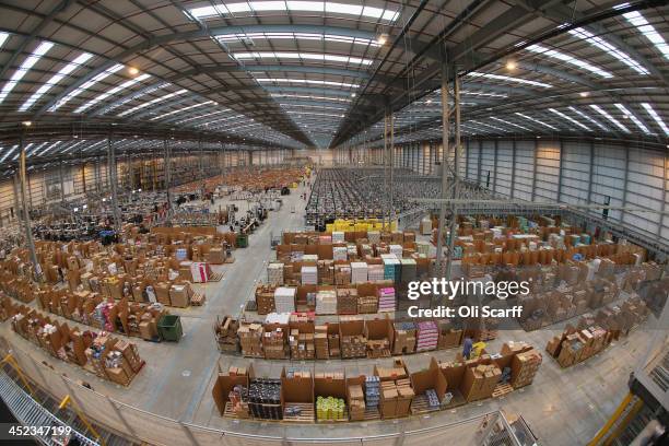 Employees select and dispatch items in the huge Amazon 'fulfilment centre' warehouse on November 28, 2013 in Peterborough, England. The online...