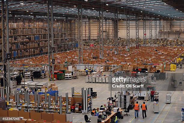 Employees select and dispatch items in the huge Amazon 'fulfilment centre' warehouse on November 28, 2013 in Peterborough, England. The online...
