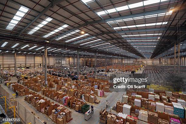 Employees select and dispatch items in the huge Amazon 'fulfilment centre' warehouse on November 28, 2013 in Peterborough, England. The online...