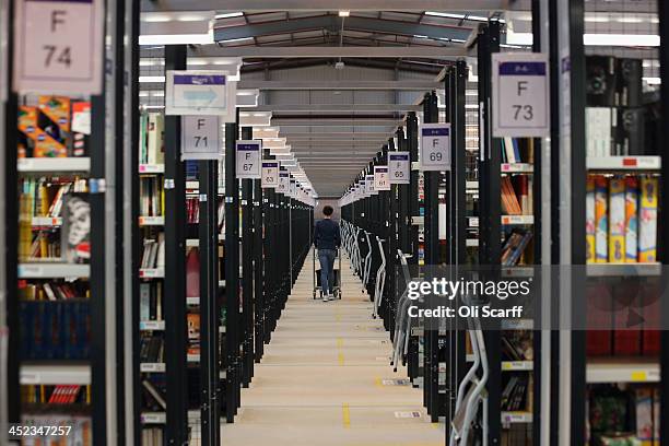 Employees select and dispatch items in the huge Amazon 'fulfilment centre' warehouse on November 28, 2013 in Peterborough, England. The online...