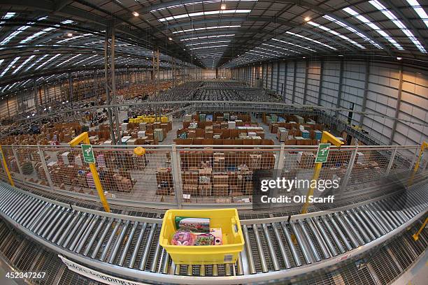 Employees select and dispatch items in the huge Amazon 'fulfilment centre' warehouse on November 28, 2013 in Peterborough, England. The online...