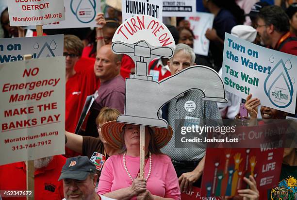 Demonstrators protest against the Detroit Water and Sewer Department July 18, 2014 in Detroit, Michigan. The Detroit Water and Sewer Department have...