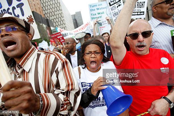 Demonstrators protest against the Detroit Water and Sewer Department July 18, 2014 in Detroit, Michigan. The Detroit Water and Sewer Department have...