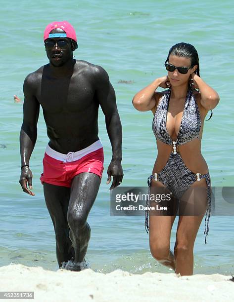 Bacary Sagna and Ludivine Kadri Sagna are sighted on Miami Beach at the W Hotel. On July 18, 2014 in Miami, Florida.