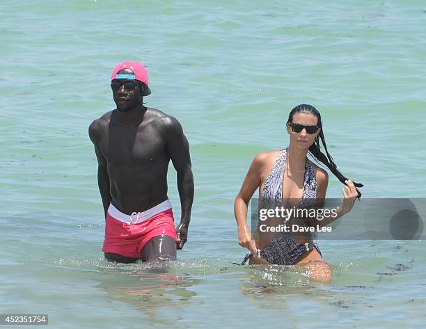 Bacary Sagna and Ludivine Kadri Sagna are sighted on Miami Beach at the W Hotel. On July 18, 2014 in Miami, Florida.