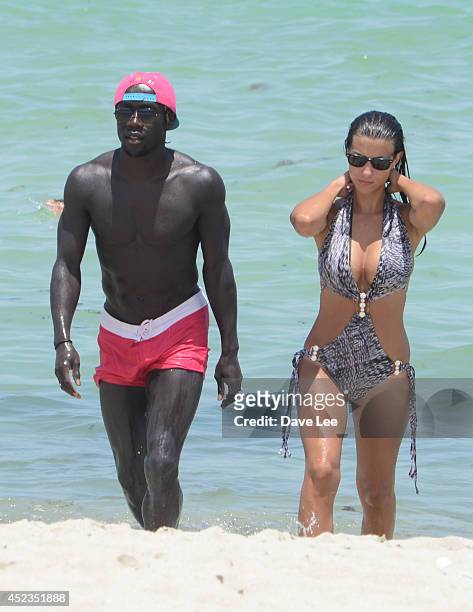 Bacary Sagna and Ludivine Kadri Sagna are sighted on Miami Beach at the W Hotel. On July 18, 2014 in Miami, Florida.