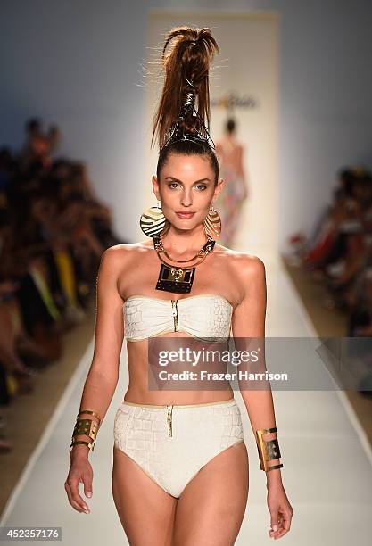 Model walks the runway during the Dolores Cortes show with TRESemme at Mercedes-Benz Fashion Week Swim 2015 at Cabana Grande at The Raleigh on July...