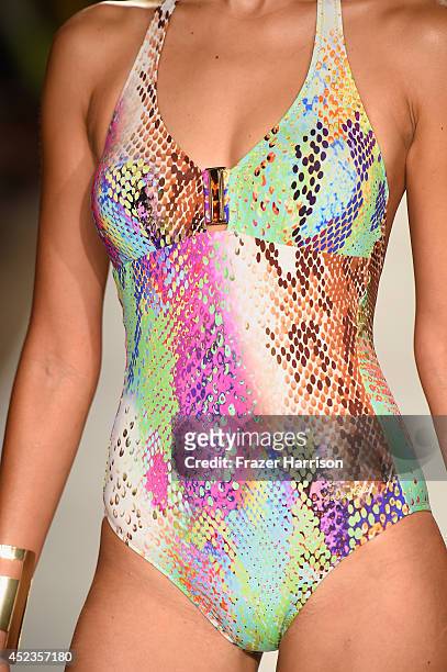 Model walks the runway during the Dolores Cortes show with TRESemme at Mercedes-Benz Fashion Week Swim 2015 at Cabana Grande at The Raleigh on July...