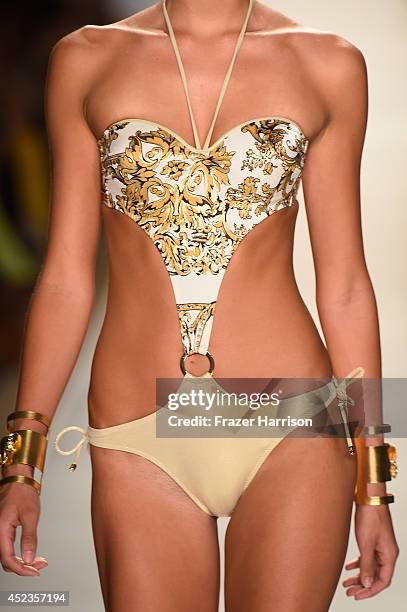 Model walks the runway during the Dolores Cortes show with TRESemme at Mercedes-Benz Fashion Week Swim 2015 at Cabana Grande at The Raleigh on July...