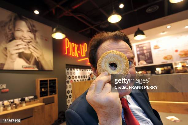 The founder and chairman of the French bakery-cafe Le Duff, Louis Le Duff, poses on November 28, 2013 in one of his Bruegger's restaurants in the...