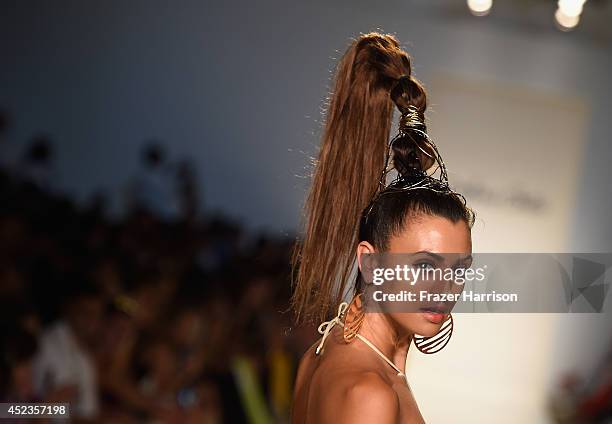 Model walks the runway during the Dolores Cortes show with TRESemme at Mercedes-Benz Fashion Week Swim 2015 at Cabana Grande at The Raleigh on July...