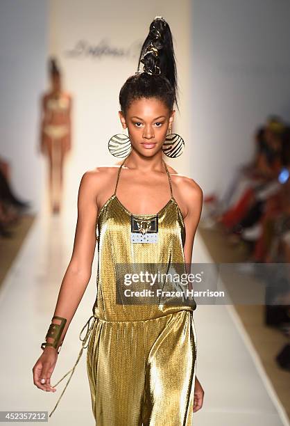 Model walks the runway during the Dolores Cortes show with TRESemme at Mercedes-Benz Fashion Week Swim 2015 at Cabana Grande at The Raleigh on July...