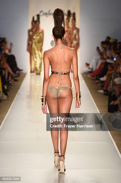 Model walks the runway during the Dolores Cortes show with TRESemme at Mercedes-Benz Fashion Week Swim 2015 at Cabana Grande at The Raleigh on July...