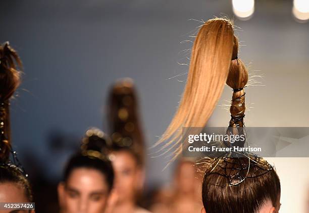 Model walks the runway during the Dolores Cortes show with TRESemme at Mercedes-Benz Fashion Week Swim 2015 at Cabana Grande at The Raleigh on July...