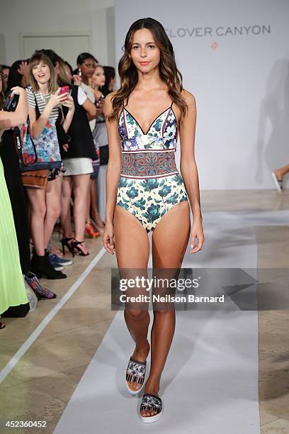 Model walks the runway at the Clover Canyon presentation during Mercedes-Benz Fashion Week Swim 2015 at The Raleigh on July 18, 2014 in Miami Beach,...