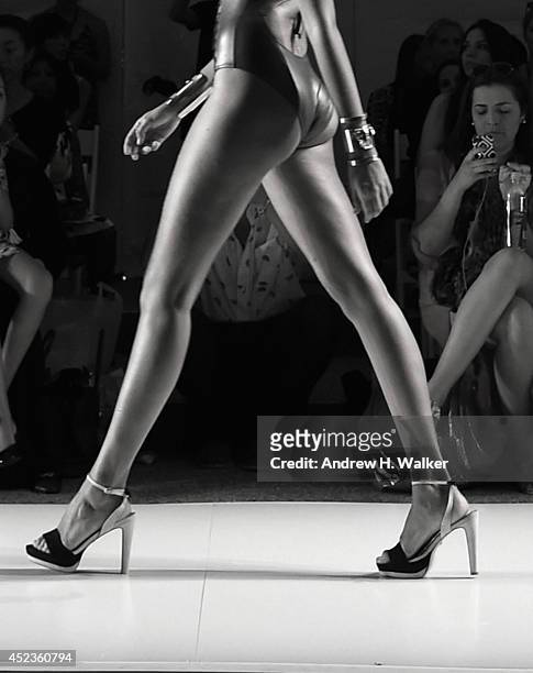 Model walks the runway during the Dolores Cortes show at Mercedes-Benz Fashion Week Swim 2015 at The Raleigh on July 18, 2014 in Miami Beach, Florida.