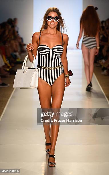 Model walks the runway at Wildfox Swim Cruise 2015 show during Mercedes-Benz Fashion Week Swim 2015 at Cabana Grande at The Raleigh on July 18, 2014...